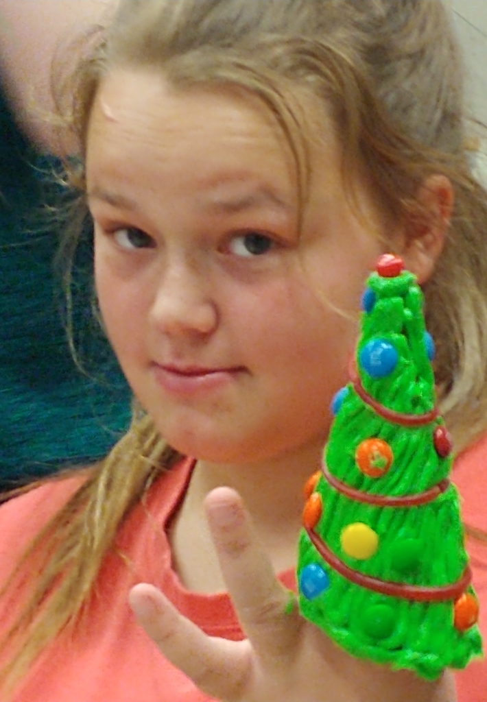 Sophomore Brooklynn Kaiser with her Christmas tree cone. 